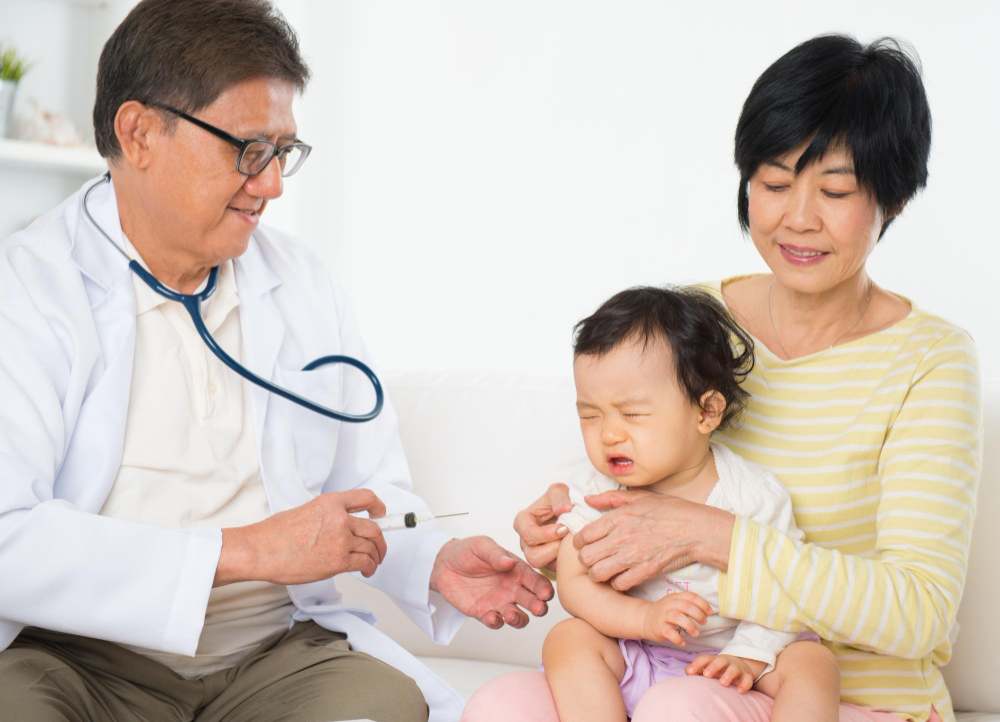 Doctor is checking a child