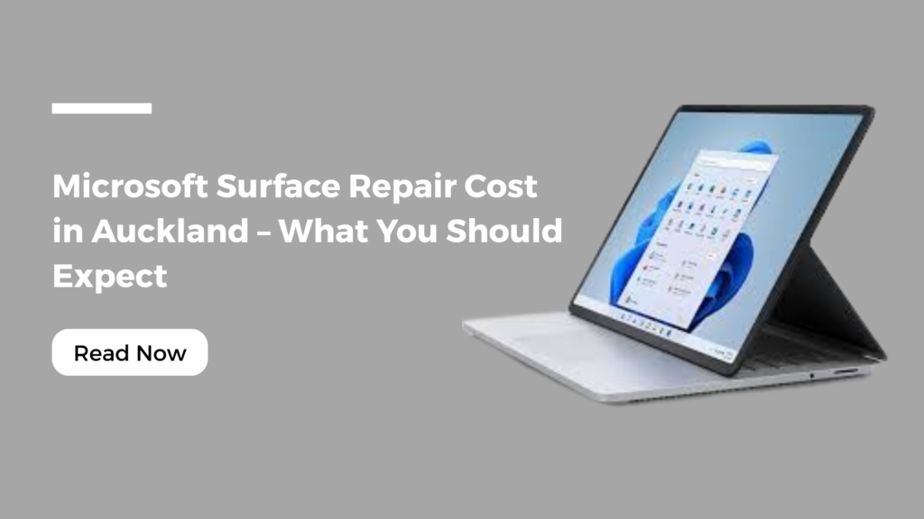 A Microsoft Surface laptop displayed on a grey background with text reading “Microsoft Surface Repair Cost in Auckland – What You Should Expect” and a “Read Now” button, promoting Smashed It Auckland repair services.