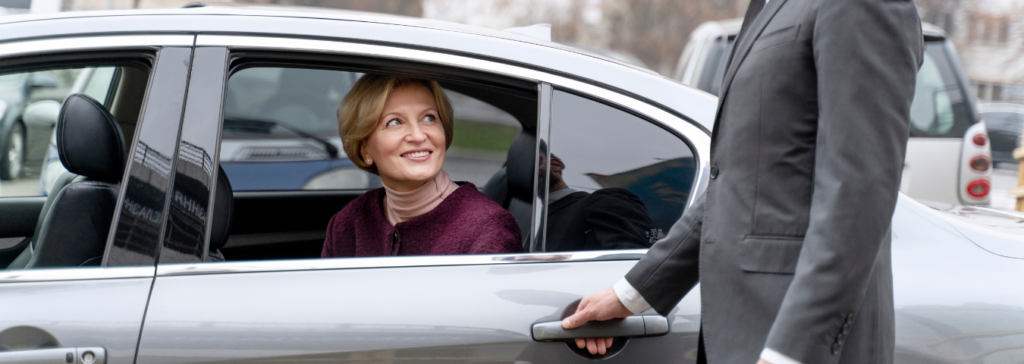man opening car door for a lady